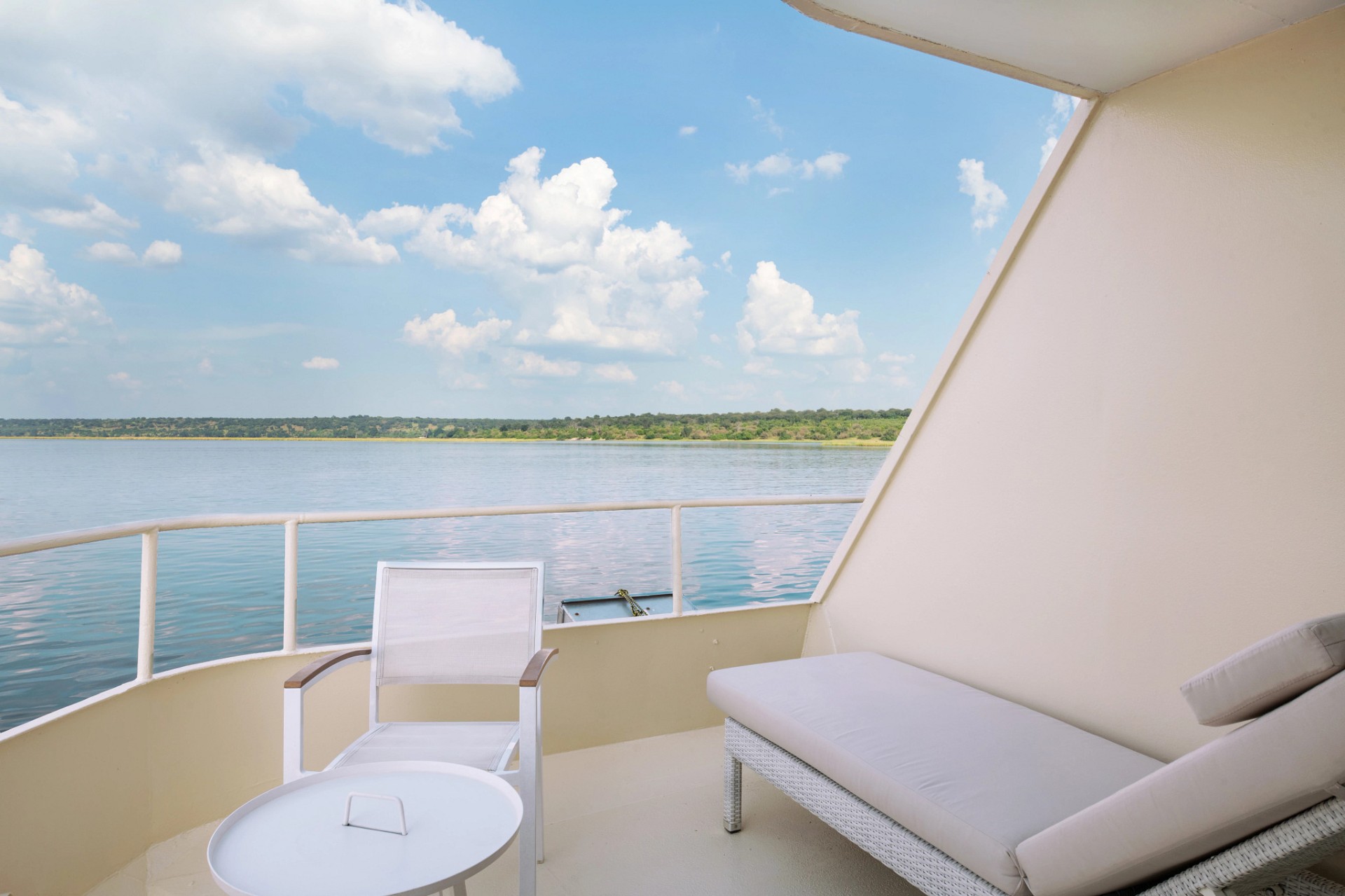 Private suite balcony looking out over calm river water